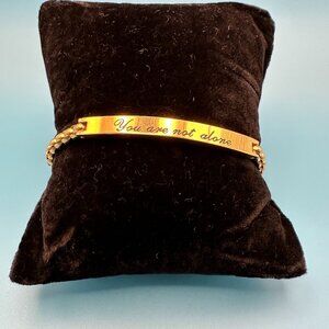 STEELTIME stainless steel gold-tone bracelet engraved “You are not alone"